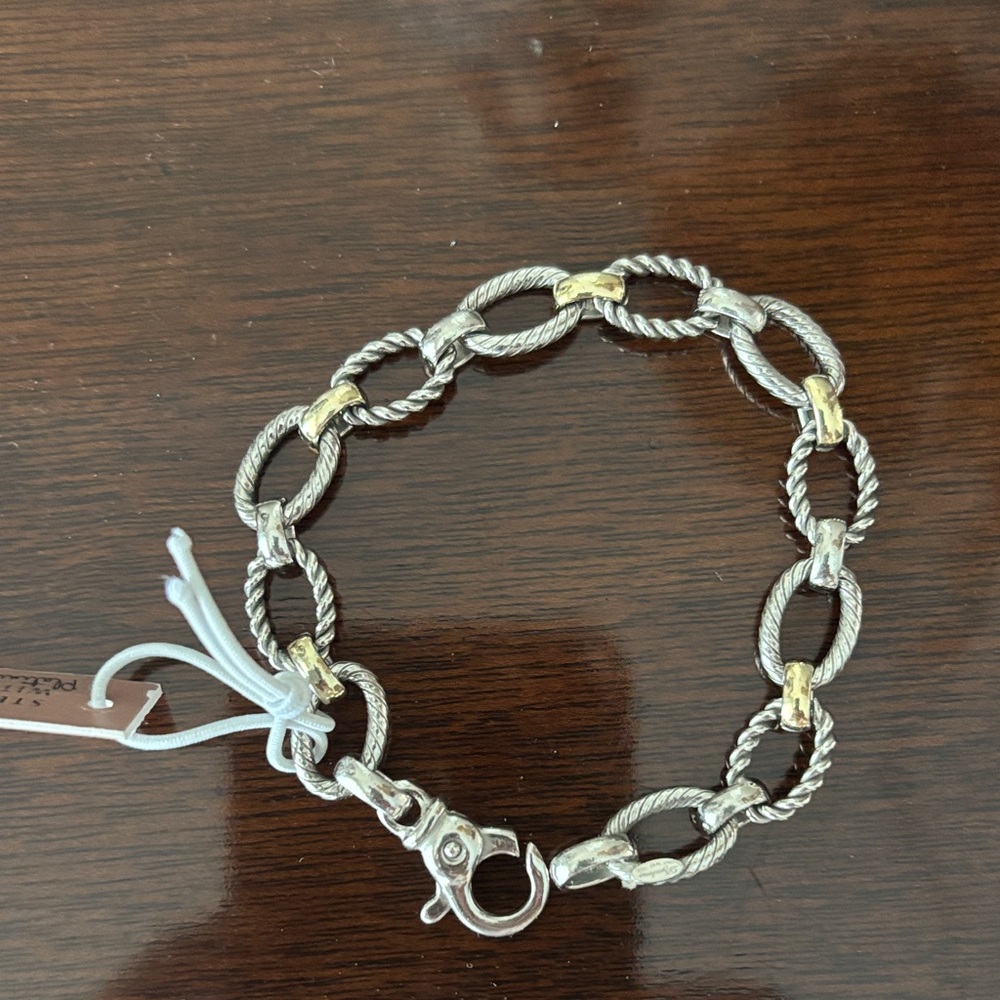 Sterling Silver chain bracelet w/platinum plating and gold links are 14k Gold.